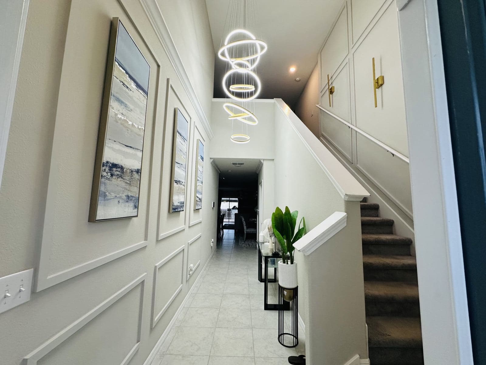 Ring chandelier installed over a stairwell
