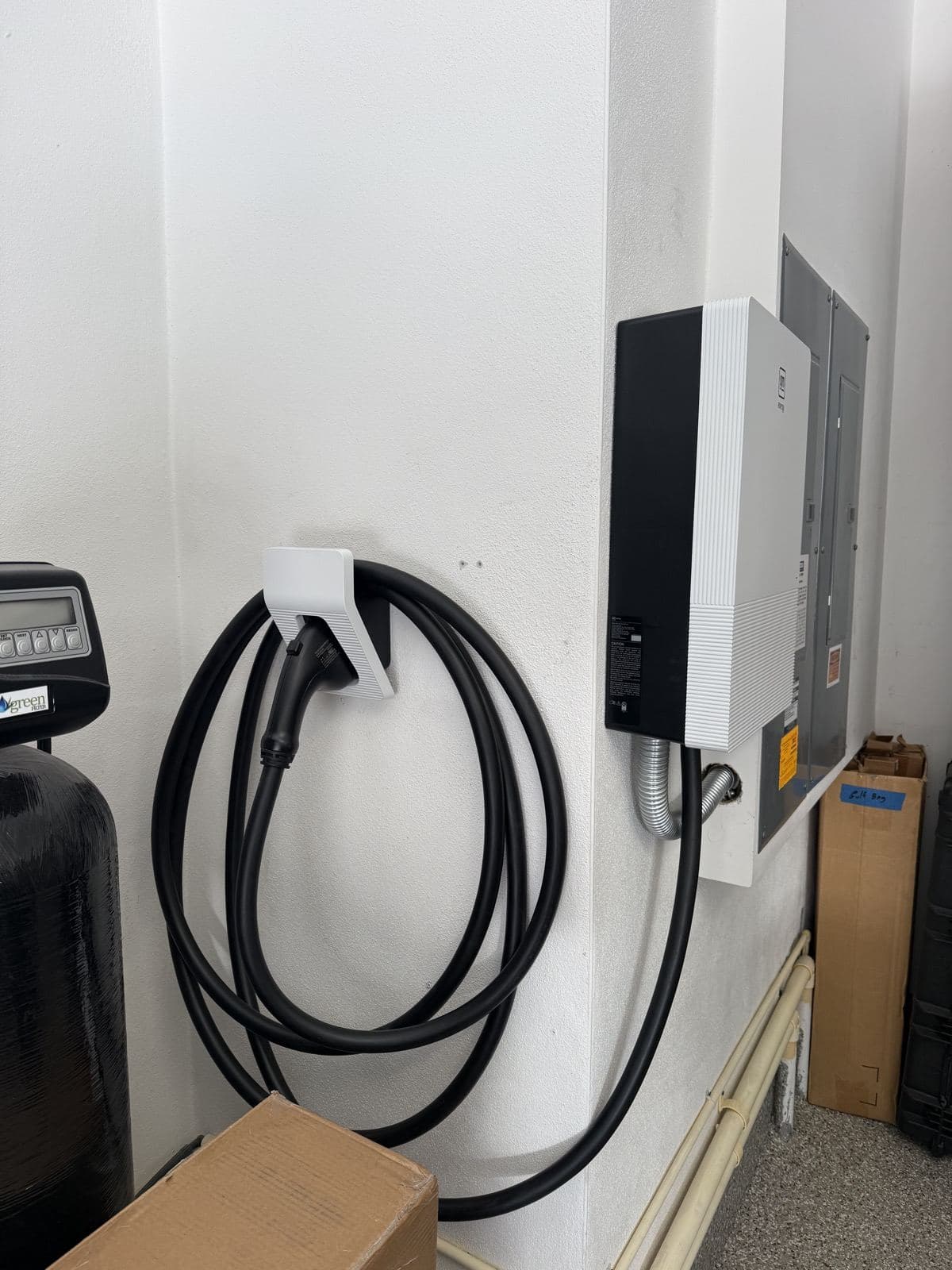 Wall-mounted EV charger installed in a garage